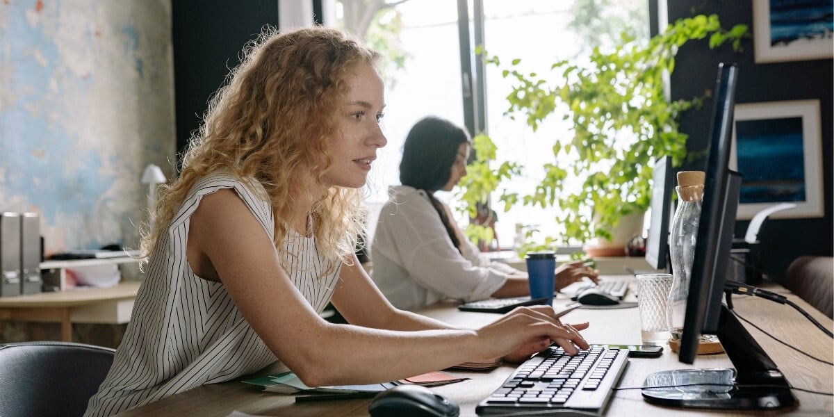 Canadian business professional using Microsoft Copilot for document automation and productivity in modern office workspace