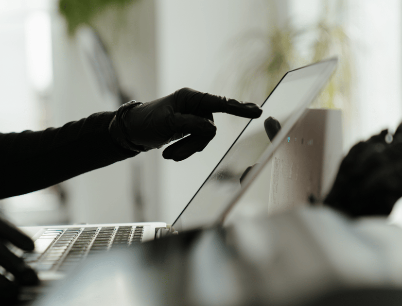 Phishing attacks targeting Canadian businesses illustrated by cybersecurity professionals analyzing suspicious email threats in a corporate environment.