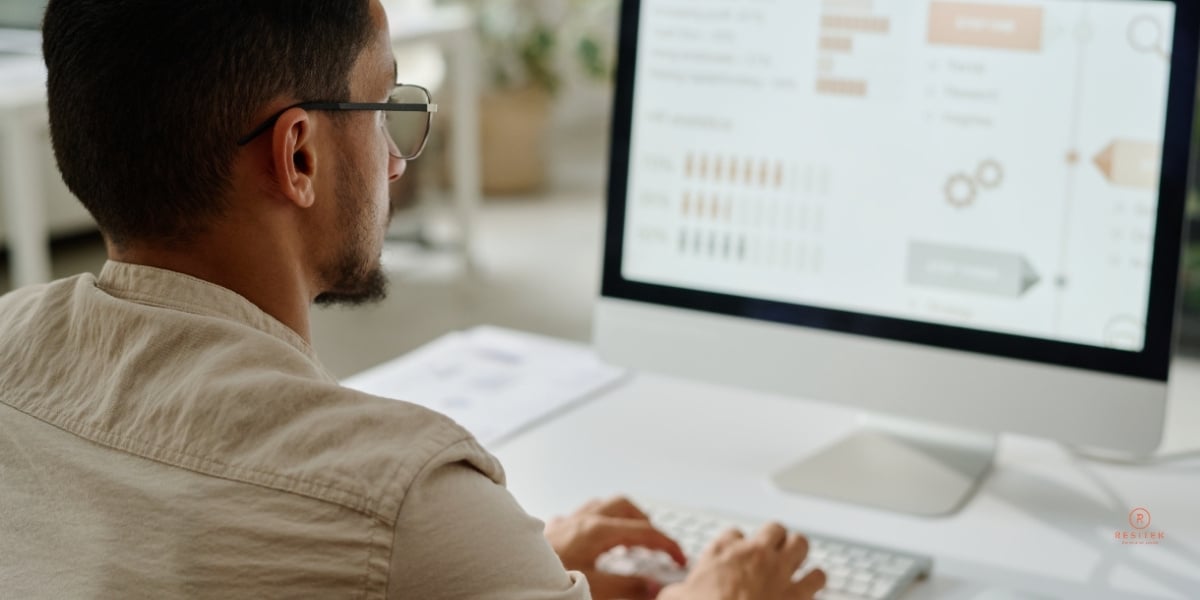 CFO analyzing IT cost comparison between in-house and outsourced managed IT services for Canadian business